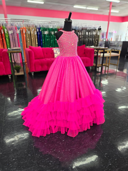 This Tiffany Princess pageant dress (style 13795) features a high neck, crystal embellishments, and a backless corset. The ruffle tulle skirt adds a touch of elegance, while the corset provides a secure fit. Perfect for any pageant girl looking to make a statement on stage.