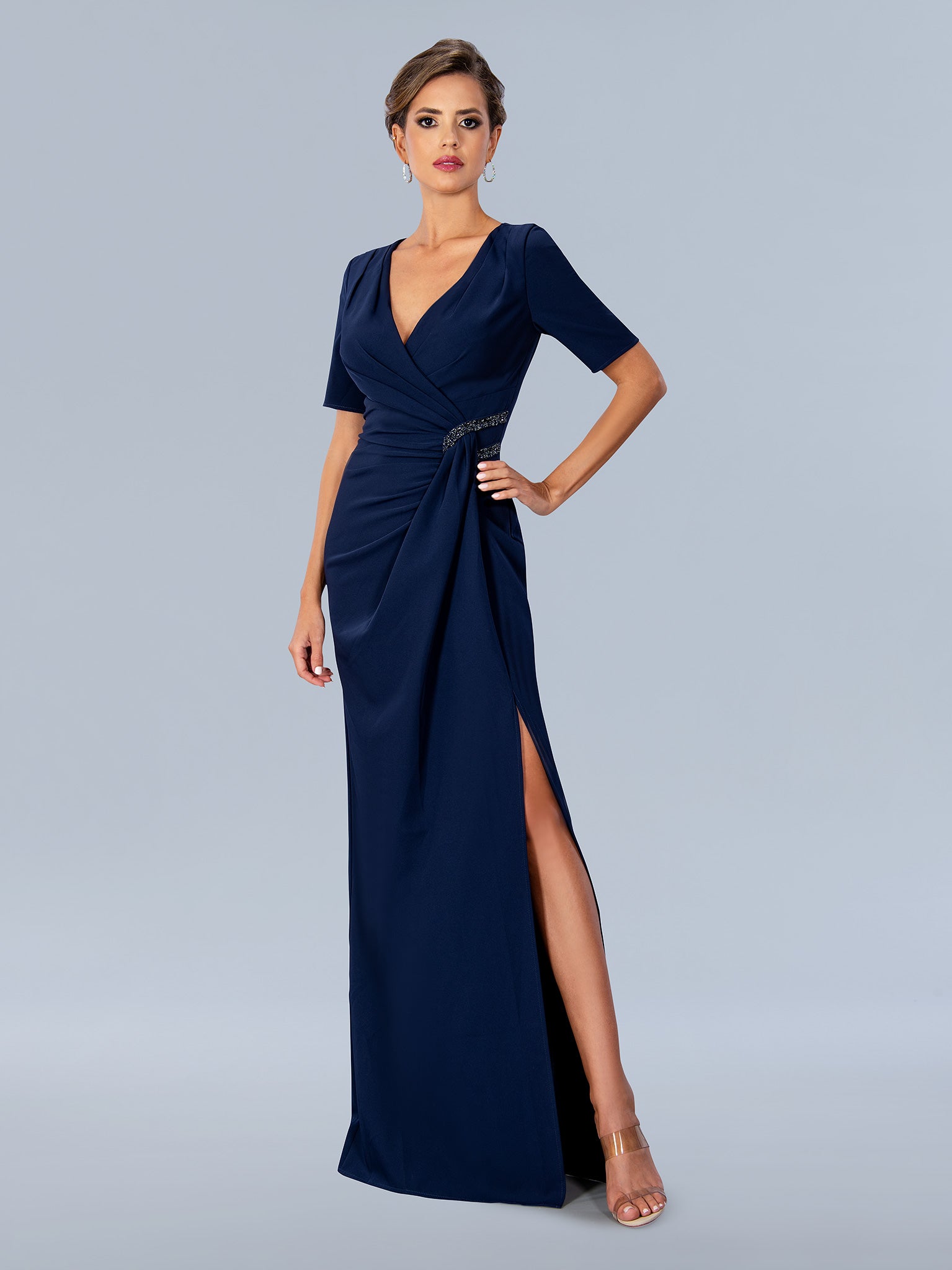 Elevate your special occasion look with the Stella Couture 24317 navy formal gown, designed in size 10 for a refined fit. This mother-of-the-bride dress features elegant short sleeves and sophisticated ruching that flatters your silhouette. A tasteful slit adds a modern touch, ensuring ease of movement while maintaining formal elegance. Crafted with attention to detail, this gown combines comfort and style for a polished and confident appearance at any event.

Size: 10

Color: Navy