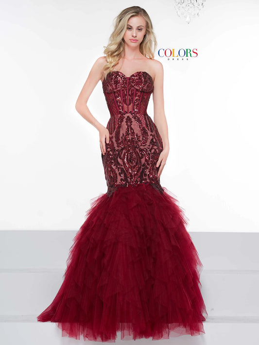 This Colors Dress 2067 features a stunning strapless mermaid design, enhanced with intricate sequin detailing. The mesh ruffle skirt adds a touch of elegance, while the lace-up back provides a perfect fit. Ideal for formal occasions and pageants.