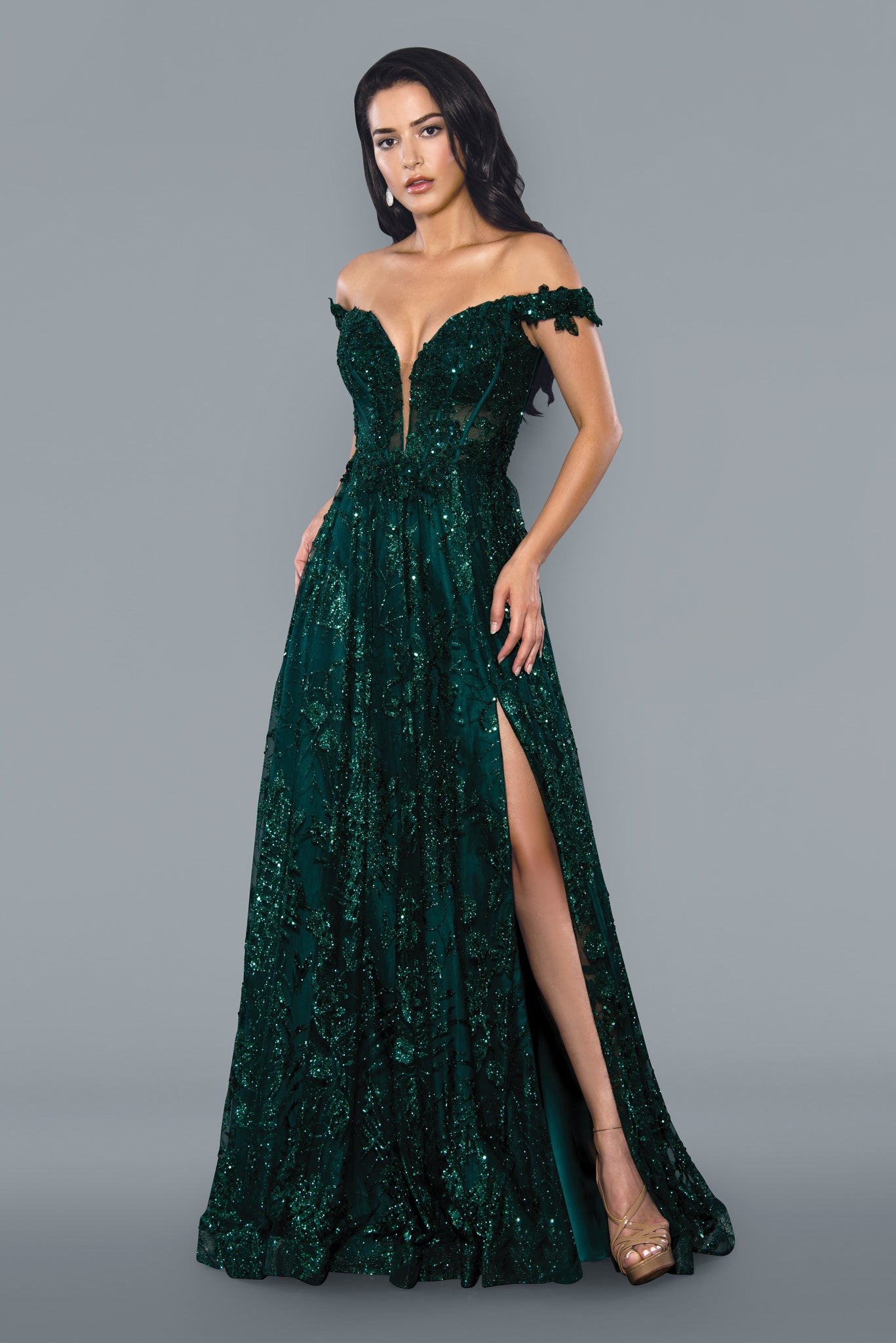 Stella Couture 21064 is a long a line formal prom and pageant dress. Featuring a plunging deep V Neckline with a sheer embellished bodice and off the shoulder straps. high slit in skirt. lace up corset back. Great for any formal event.  Available Size: 0-18  Available Color: Green, Blue, Sage, Royal