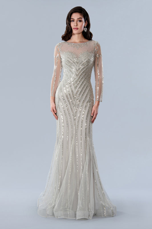 This luxurious Stella Couture 23369 gown is the perfect choice for black-tie occasions. Boasting a fully beaded and sequin-embellished sheer construction, it features beautiful long sleeves and a high neckline, perfect for making a dazzling entrance. Crafted with a mermaid shape, it's sure to flatter the figure.  Sizes: 6-20  Colors: Silver