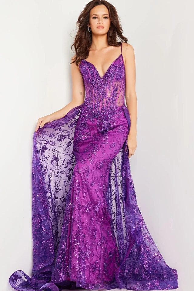 The Jovani 23530 is a show-stopping prom dress from the formal collection, designed to make a dramatic and unforgettable entrance at your special event. Crafted from delicate tulle, this gown exudes an ethereal and graceful quality. In terms of style, the dress follows a sheath silhouette, offering a sleek and contemporary look that gracefully drapes along your figure. 
