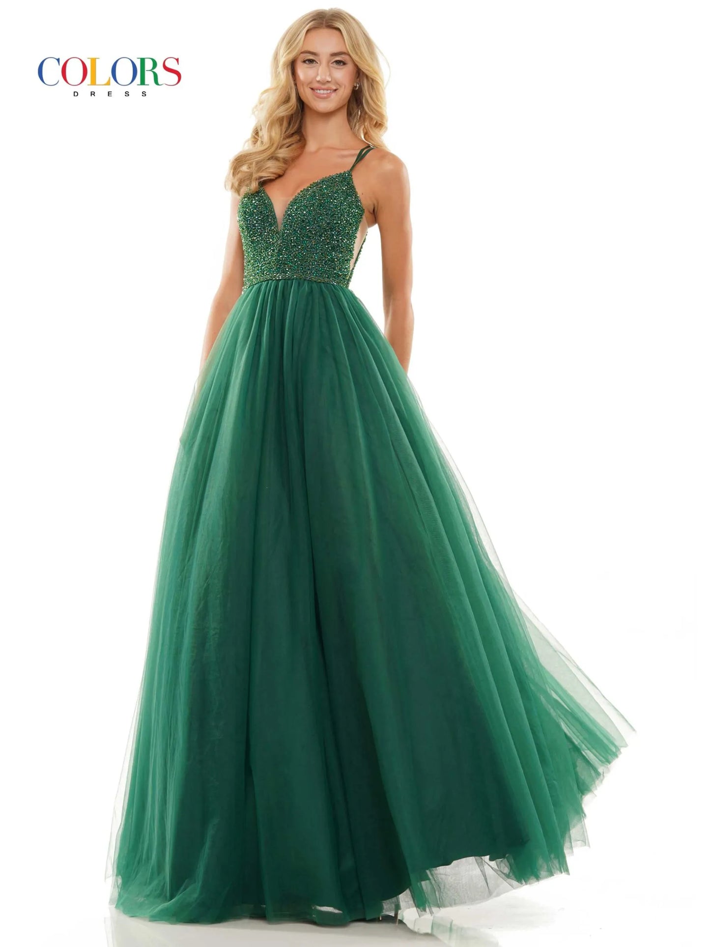 Make a statement in Colors 2382 Long Tulle Ballgown. Featuring a crystal V-neck, open corset back and formal ballgown skirt, this glamorous gown is the perfect choice for prom or any special night. 47" tulle gown with beaded bodice, sheer side panels, plunged V neck and lace up back detail  Sizes: 0-20   Colors: Black, Red, Emerald, Off White, Royal Purple