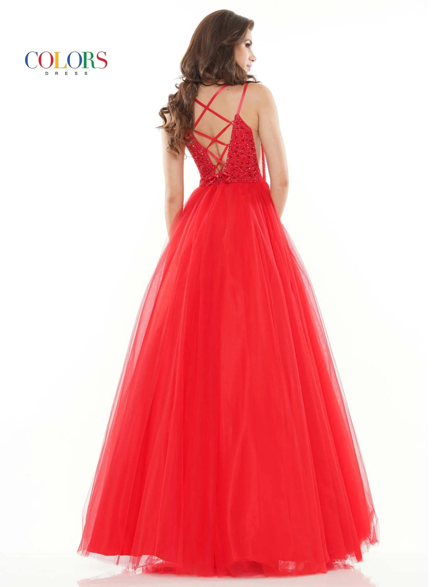 Make a statement in Colors 2382 Long Tulle Ballgown. Featuring a crystal V-neck, open corset back and formal ballgown skirt, this glamorous gown is the perfect choice for prom or any special night. 47" tulle gown with beaded bodice, sheer side panels, plunged V neck and lace up back detail  Sizes: 0-20   Colors: Black, Red, Emerald, Off White, Royal Purple