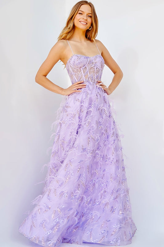 Jovani 24078 Lilac Sequin And Feather Embellished A-Line Sheer Corset Bodice Prom Gown. Introducing the Jovani 24078 prom gown. Crafted from a sheer corset bodice, this A-line design is perfect for special occasions. Featuring an ornate arrangement of lilac sequins and feathers, the bodice creates a truly eye-catching look. Let yourself sparkle in this luxurious and timeless gown.   