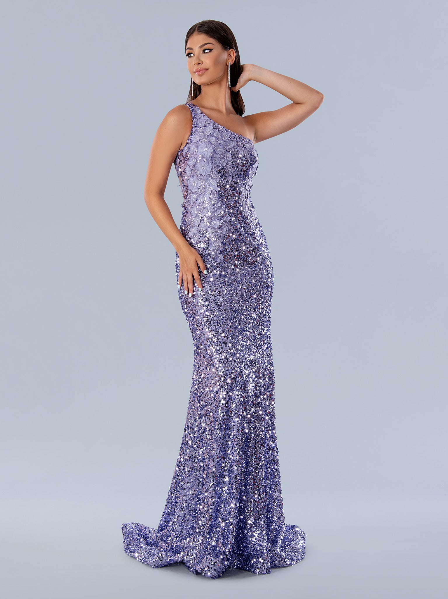 Stella Couture 24155 is a stunning One Shoulder Sequin Lace Prom Dress with a Sheer Back and 3d floral lace appliques. This elegant formal gown will make the perfect statement and turn heads at your special event.  Sizes: 0-16  Colors: Lilac
