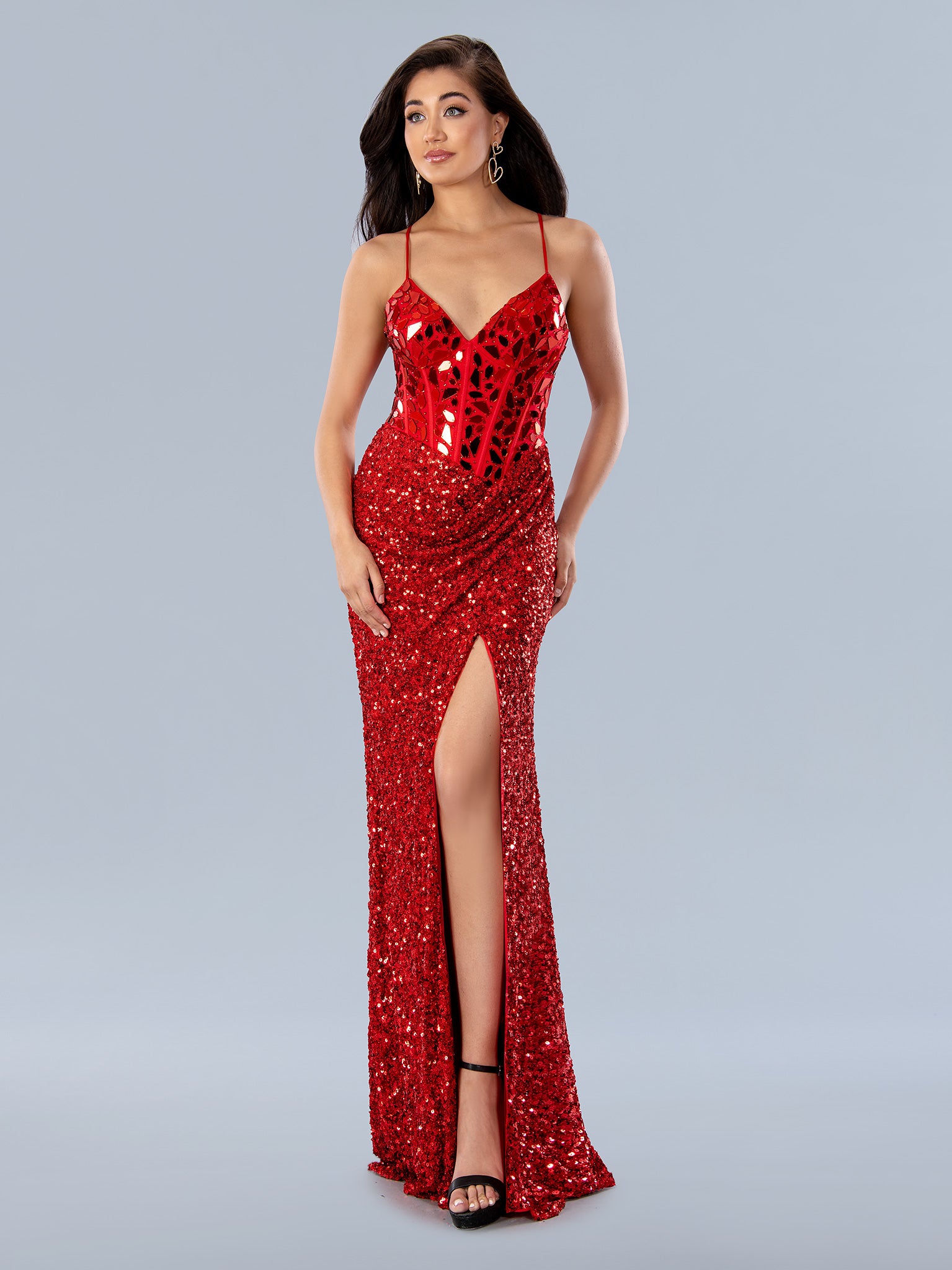 Look breathtaking in Stella Couture 24161. This floor-length dress features a V-neckline and a sparkling sequin-cut corset bodice. The long, A-line skirt features a high slit for a touch of allure. Perfect for formal prom events or special occasions.  Sizes: 0-24  Colors: BLACK, RED, SILVER