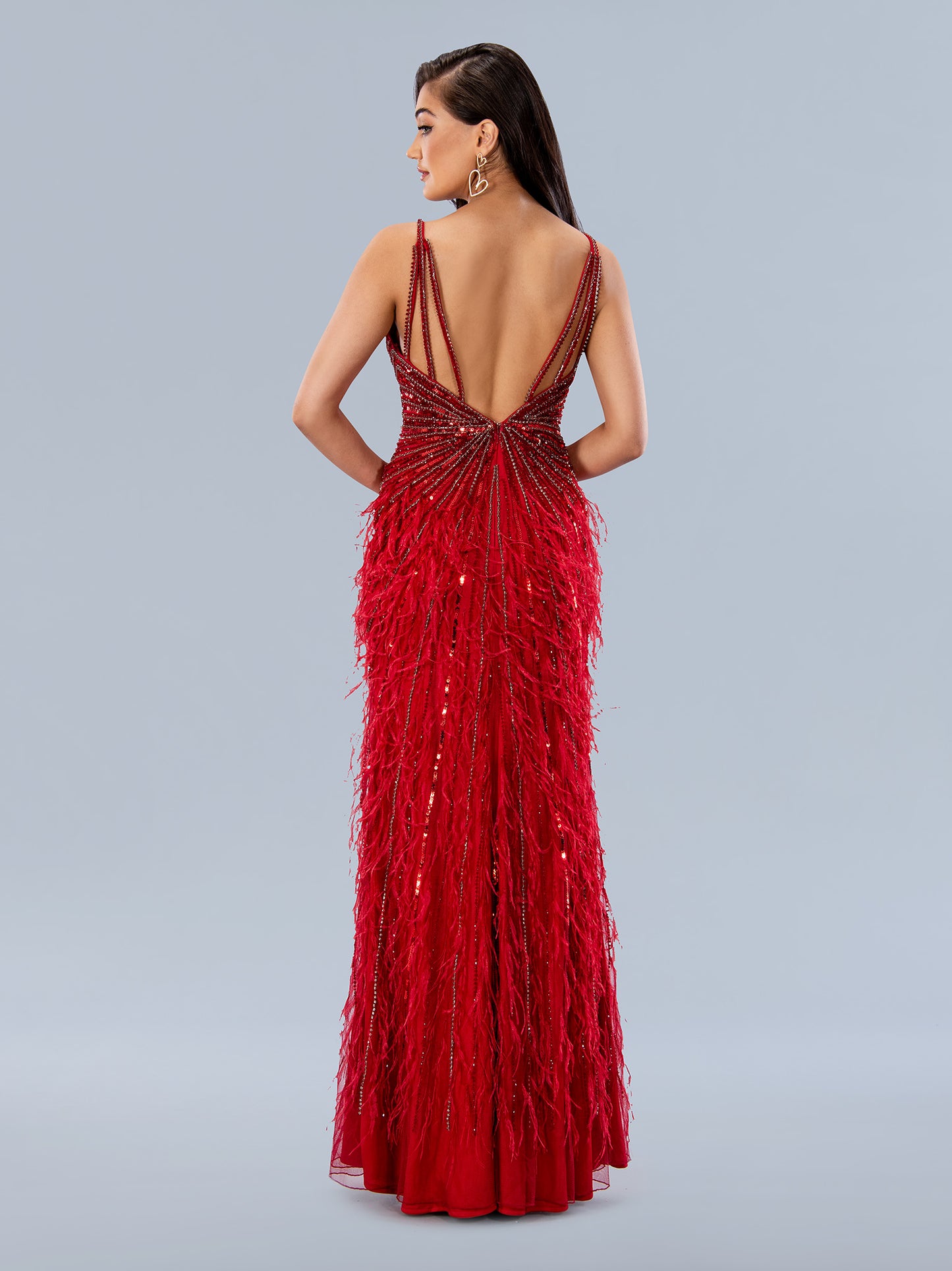 The Stella Couture 24206 Long Beaded Feather Prom Dress is an utterly glamorous evening gown. Crafted from high-quality sequins and adorned with intricate beaded feathers, this show-stopping piece ensures you'll turn heads. The added side split adds a touch of drama, making it the perfect dress for your special occasion.  Sizes: 0-16  Colors: Black, Off White, Wine