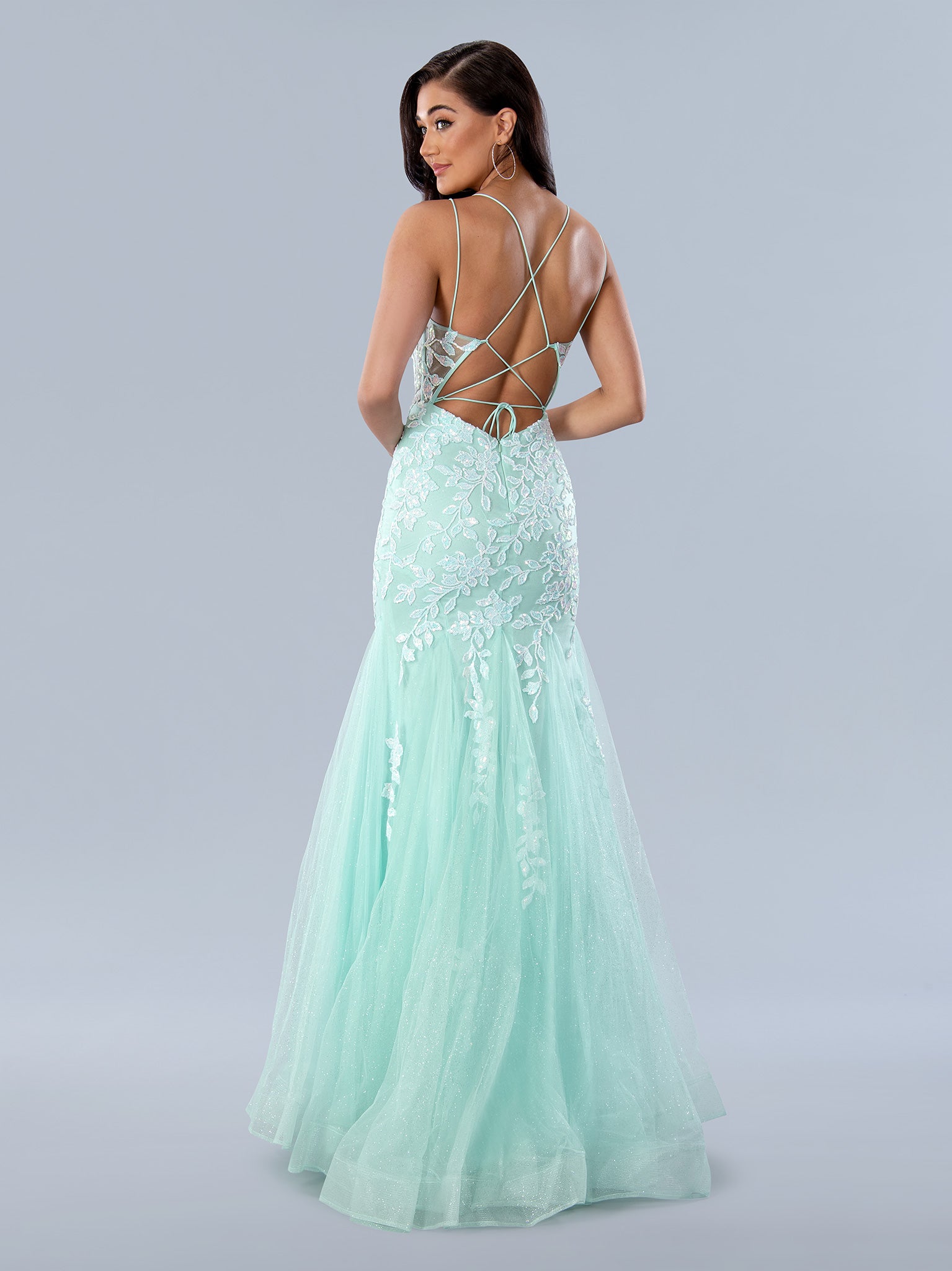 The Stella Couture 24229 is a stunning choice for prom. Crafted from shimmer fabric, this sleek and stylish mermaid dress features sequin lace detail and a sheer corset to ensure a show-stopping look. With a backless design, it's sure to turn heads.  Sizes: 0-16  Colors: Aqua
