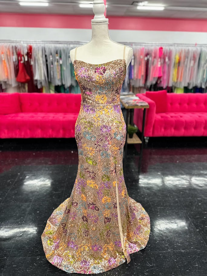 Elevate your evening with the Nina Canacci 2428, a size 4 fitted prom dress that exudes elegance. This gold gown features intricate floral sequins, a flattering scoop neckline, and a daring backless corset design. The thigh-high slit adds a touch of allure, making it perfect for unforgettable formal occasions.

Size: 4

Color: Gold