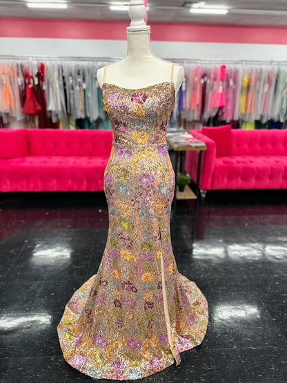 Elevate your evening with the Nina Canacci 2428, a size 4 fitted prom dress that exudes elegance. This gold gown features intricate floral sequins, a flattering scoop neckline, and a daring backless corset design. The thigh-high slit adds a touch of allure, making it perfect for unforgettable formal occasions.

Size: 4

Color: Gold
