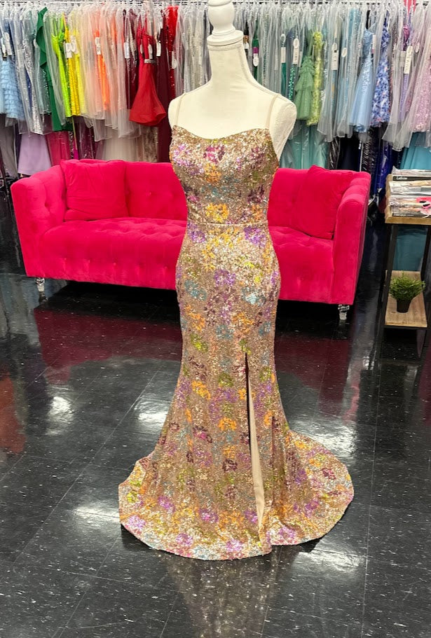 Elevate your evening with the Nina Canacci 2428, a size 4 fitted prom dress that exudes elegance. This gold gown features intricate floral sequins, a flattering scoop neckline, and a daring backless corset design. The thigh-high slit adds a touch of allure, making it perfect for unforgettable formal occasions.

Size: 4

Color: Gold