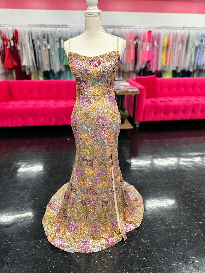 Elevate your evening with the Nina Canacci 2428, a size 4 fitted prom dress that exudes elegance. This gold gown features intricate floral sequins, a flattering scoop neckline, and a daring backless corset design. The thigh-high slit adds a touch of allure, making it perfect for unforgettable formal occasions.

Size: 4

Color: Gold