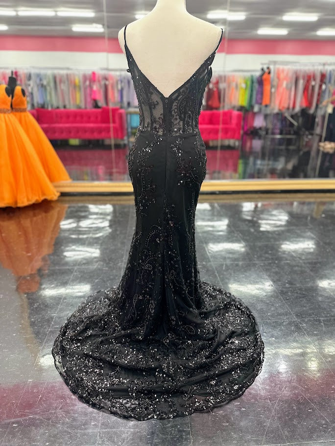 Elevate your evening with the Nina Canacci 2437, a size 4 black mermaid gown featuring intricate beading and a sheer corset design. This sophisticated prom dress contours your silhouette gracefully, combining elegance with a modern edge for unforgettable formal occasions.

Size: 4

Color: Black
