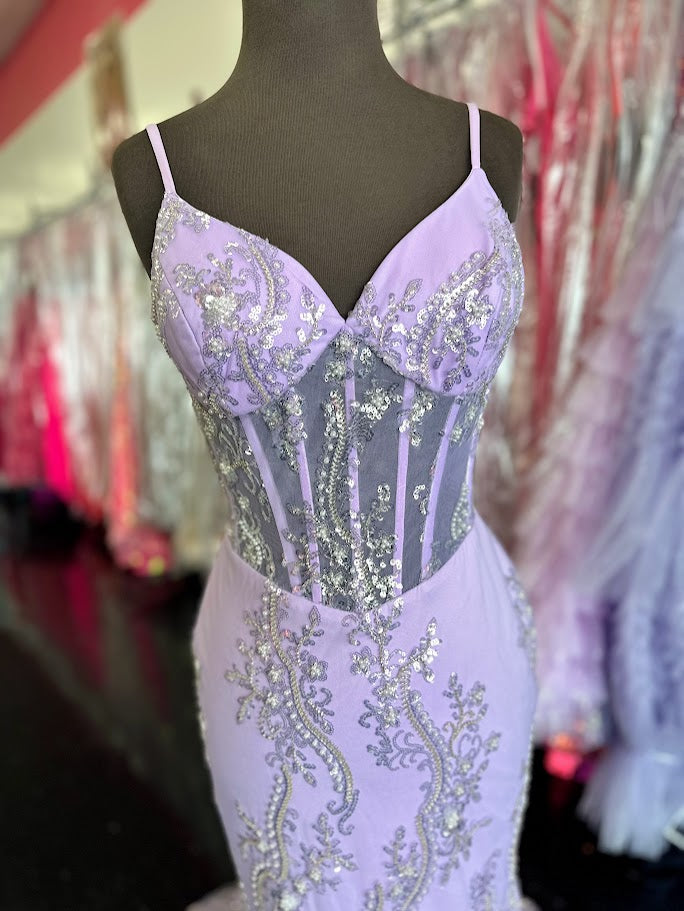 Elevate your evening with the Nina Canacci 2437, a size 4 black mermaid gown featuring intricate beading and a sheer corset design. This sophisticated prom dress contours your silhouette gracefully, combining elegance with a modern edge for unforgettable formal occasions.

Size: 4

Color: Lavender