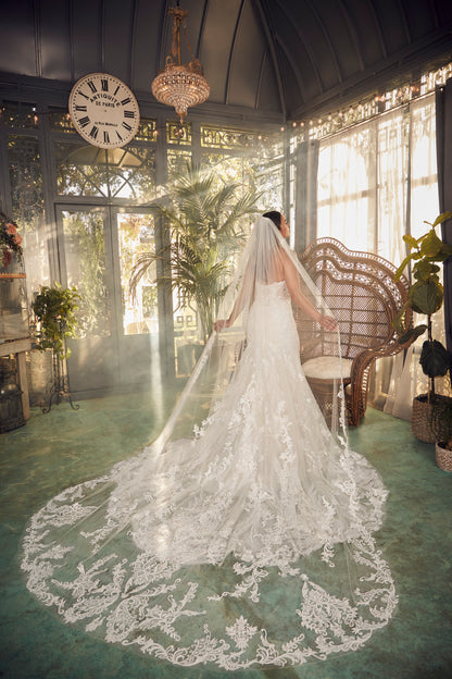 Indulge in luxury and grace with the Casablanca 2477 beaded mermaid wedding dress. The stunning long sleeve, strapless design is embellished with intricate beading, adding a touch of glamour to your special day. The fitted silhouette and elegant train will enhance your natural curves and leave you feeling like a true goddess. Artful and intricate, Style 2477 Delaney by Casablanca Bridal embodies storybook romance. Delicate lace, sequins, and beading sculpt the sweetheart neckline of this strapless fit and f