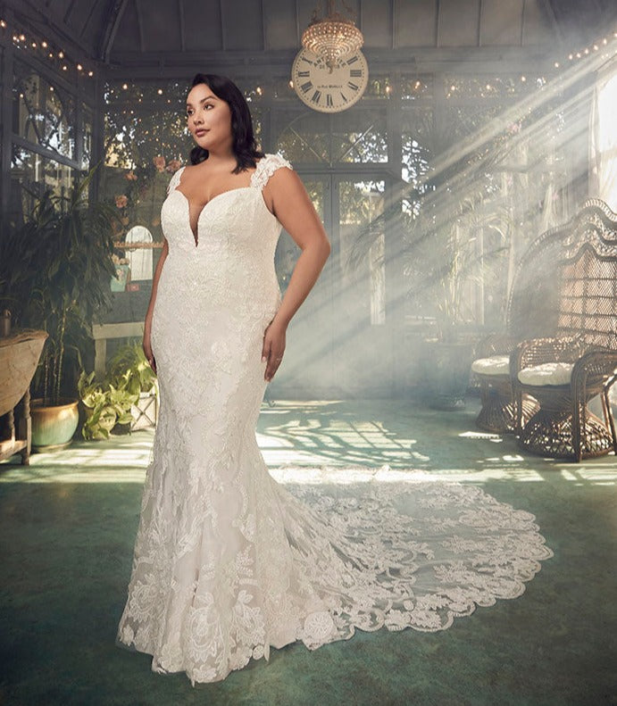 A portrait of timeless beauty, Justine Style 2485 by Casablanca Bridal is a vision of romanticism and femininity. Crafted from exquisite stretch chiffon, this figure-loving fit and flare silhouette features a plunging neckline and wide straps that frame a low-cut laced back. 