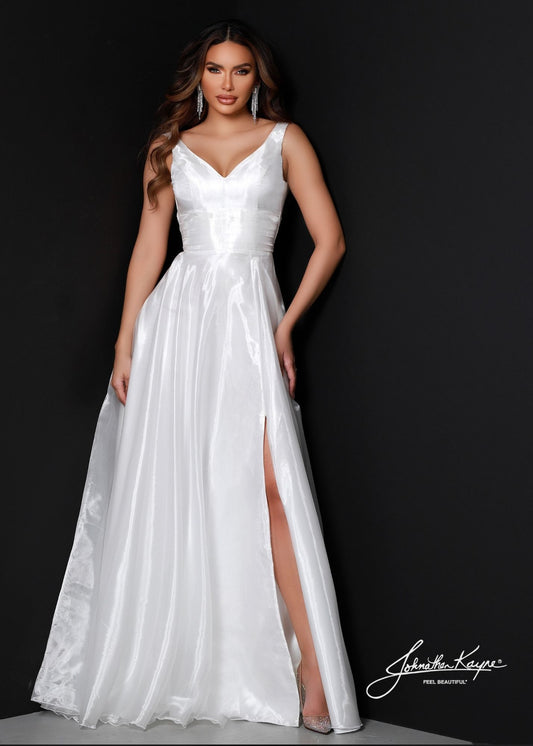 Johnathan Kayne's 2538 wedding dress is the perfect destination bridal gown for the modern bride. The sleek A-line fit, V-neck, and slit create a stylish and timeless look. This piece is sure to make a statement.  Size: 0, 14  Color: White
