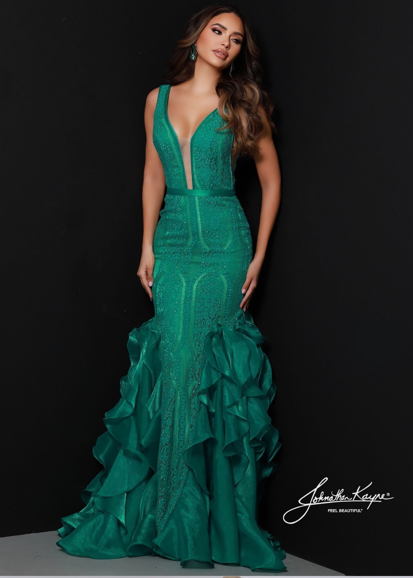 Johnathan Kayne 2542 Long Lace Ruffle Mermaid Prom Dress Pageant Gown V Neck Formal. A whimsical dream come true with this classic mermaid silhouette. The deep plunge neckline accentuates the curves and tonal stones give a touch of sparkle.  Colors: Aqua, Jade, Black, White  Sizes: 00, 0, 2, 4, 6, 8, 10, 12, 14, 16  Fabric Lace, Stretch Lining, Poly Organza