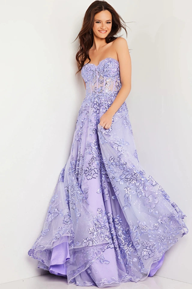 The Jovani 26223 is a breathtaking prom dress designed for the formal collection, perfect for making a stunning and memorable entrance at your special event. Crafted from delicate tulle, this gown exudes an ethereal and graceful quality, adding a touch of whimsy to your overall look.  In terms of style, the dress follows an A-line silhouette, offering a universally flattering and timeless appearance that complements various body types.