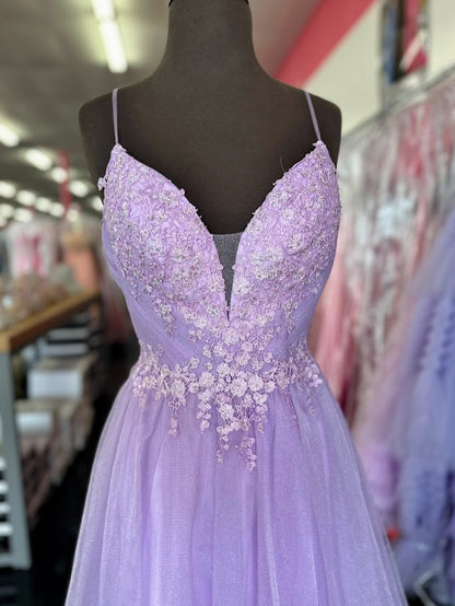 Elevate your evening with the Johnathan Kayne 2657 prom dress, featuring a delicate lilac tulle A-line silhouette that gracefully flatters size 4 figures. The intricate lace front adds timeless elegance, while the dual slits offer a modern, alluring touch. A flattering V-neckline completes this sophisticated formal gown, perfect for making a memorable statement at any special occasion. *ONE OF A KIND*

Size: 4

Color: Lilac