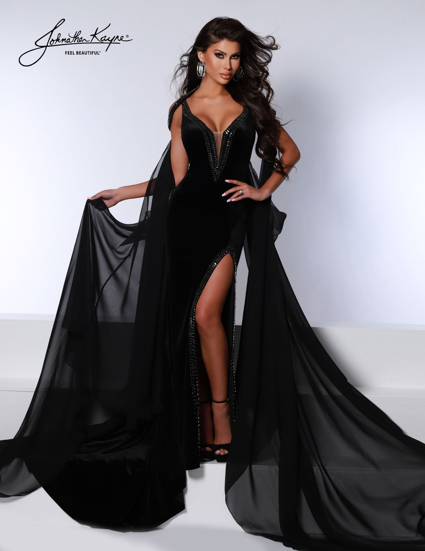 Look stunning in the Johnathan Kayne 2731 dress. Crafted from plush velvet with stretch sequins and a chiffon mesh overlay, this glamorous gown features a flattering V-neckline, a slit in the skirt, and a sparkling sequined waistband. Make an unforgettable entrance at your next special event.     Sizes:00,0,2,4,6,8,10,12,14,16  Colors: Black, Ocean , Rose 