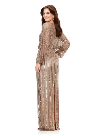 Ashley Lauren 11302 Dolman Sleeve V-Neck Fully Hand Beaded Floral Pattern Waistline Gown. This stunning sequin gown features gorgeous beading throughout and an elegant floral pattern at the waistline. With dolman sleeves, this v-neckline gown is perfect for your next event.