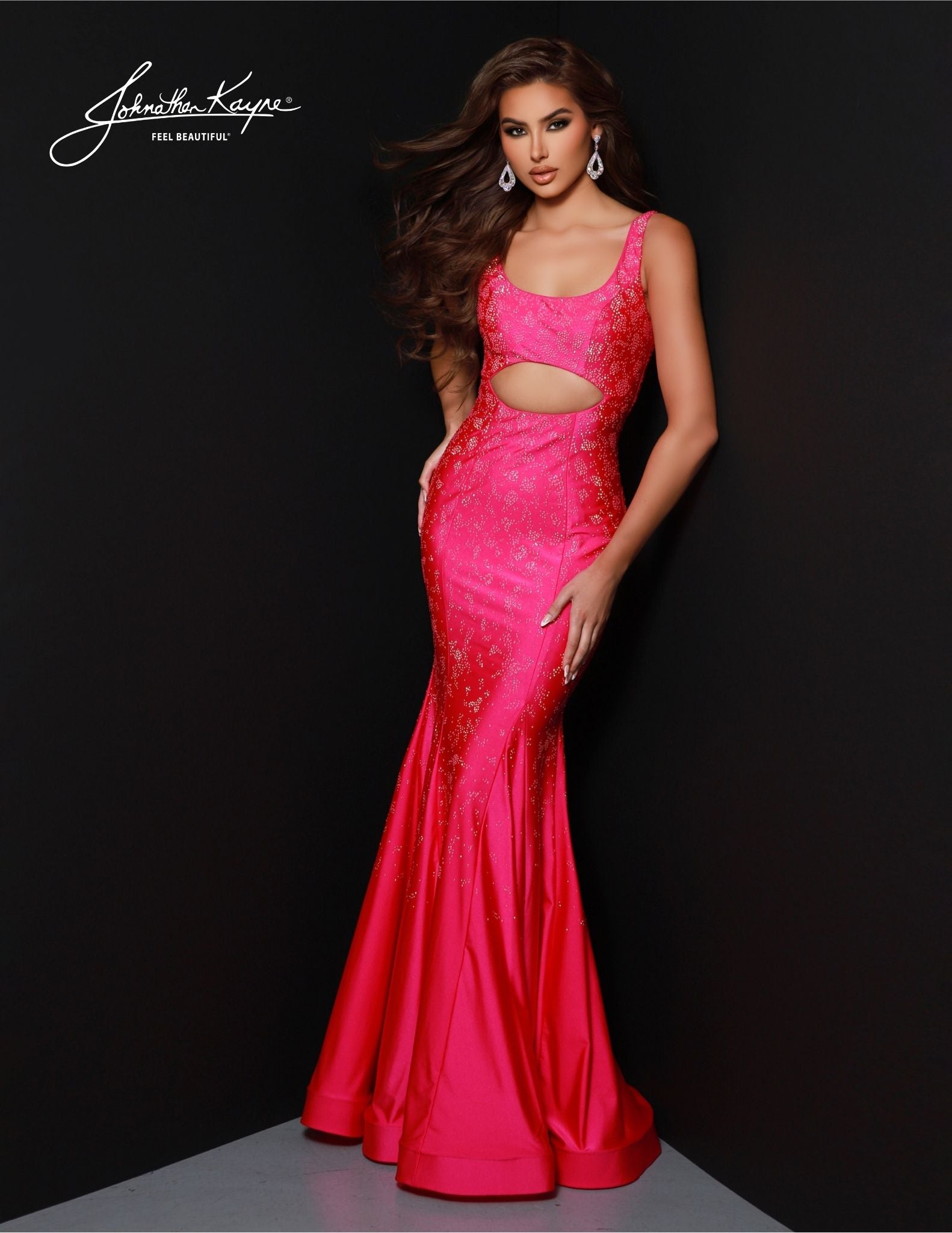 The Johnathan Kayne 2806 Prom Dress is a stunning and sophisticated formal gown. Its scoop neck bodice and mermaid silhouette create a timeless and graceful look. The delicate cutouts keep this classic look modern and chic. Enjoy partying in style this season with this amazing formal gown. Dazzle and mesmerize! This 4 Way Stretch Lycra gown features a bodice cutout that is designed to leave a lasting impression. 