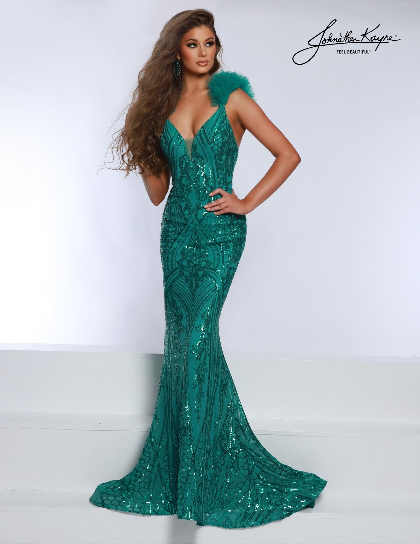 This Johnathan Kayne 2807 Long Prom Dress is designed with a sequined bodice, ruffled tulle straps, and a mermaid-style skirt. Perfect for formal occasions, it creates an elegant and eye-catching look. Make an unforgettable entrance and stay comfortable all night with the high-quality tulle and sequins. Shine and captivate in this fitted Sequin Powermesh gown – a stunning masterpiece designed to make you the center of attention, especially with the ruffle tulle straps!
