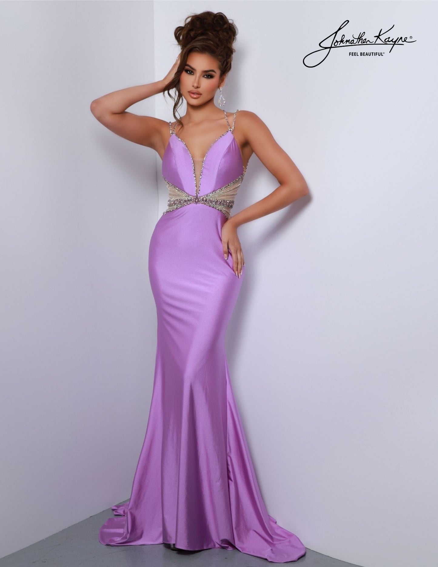 Johnathan Kayne 2808 long prom dress features a stunning beaded design, sheer side cut-outs and a deep V neckline. The perfect formal gown for pageants, dances, and special occasions. Experience elegance and comfort in this 4-Way Stretch Lycra gown. The beaded sheer side cut-outs and deep V neckline create a sultry, stylish look for any special occasion.