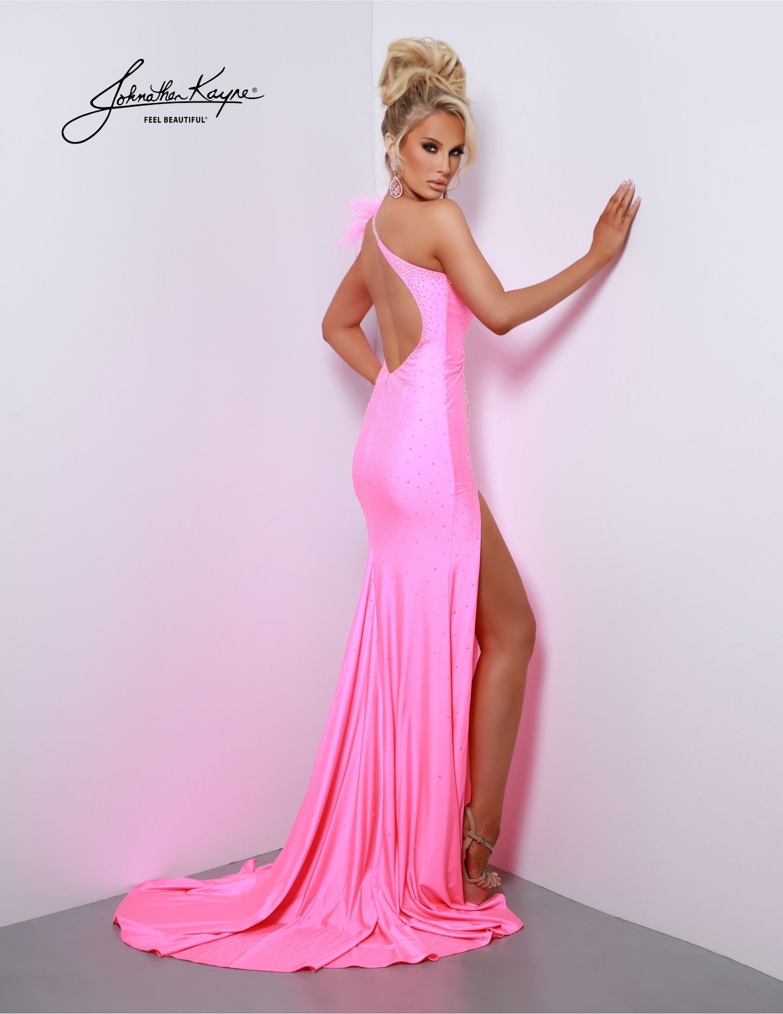 The Johnathan Kayne 2810 Long Prom Dress exudes elegance with its fitted one-shoulder style, intricate feathered accents, and dramatic maxi slit. Stylish and sophisticated, this formal gown is sure to make a lasting impression. Let your inner diva shine bright in this 4 Way Stretch Lycra gown. This dress will ensure that all eyes are on you as you make a grand entrance.