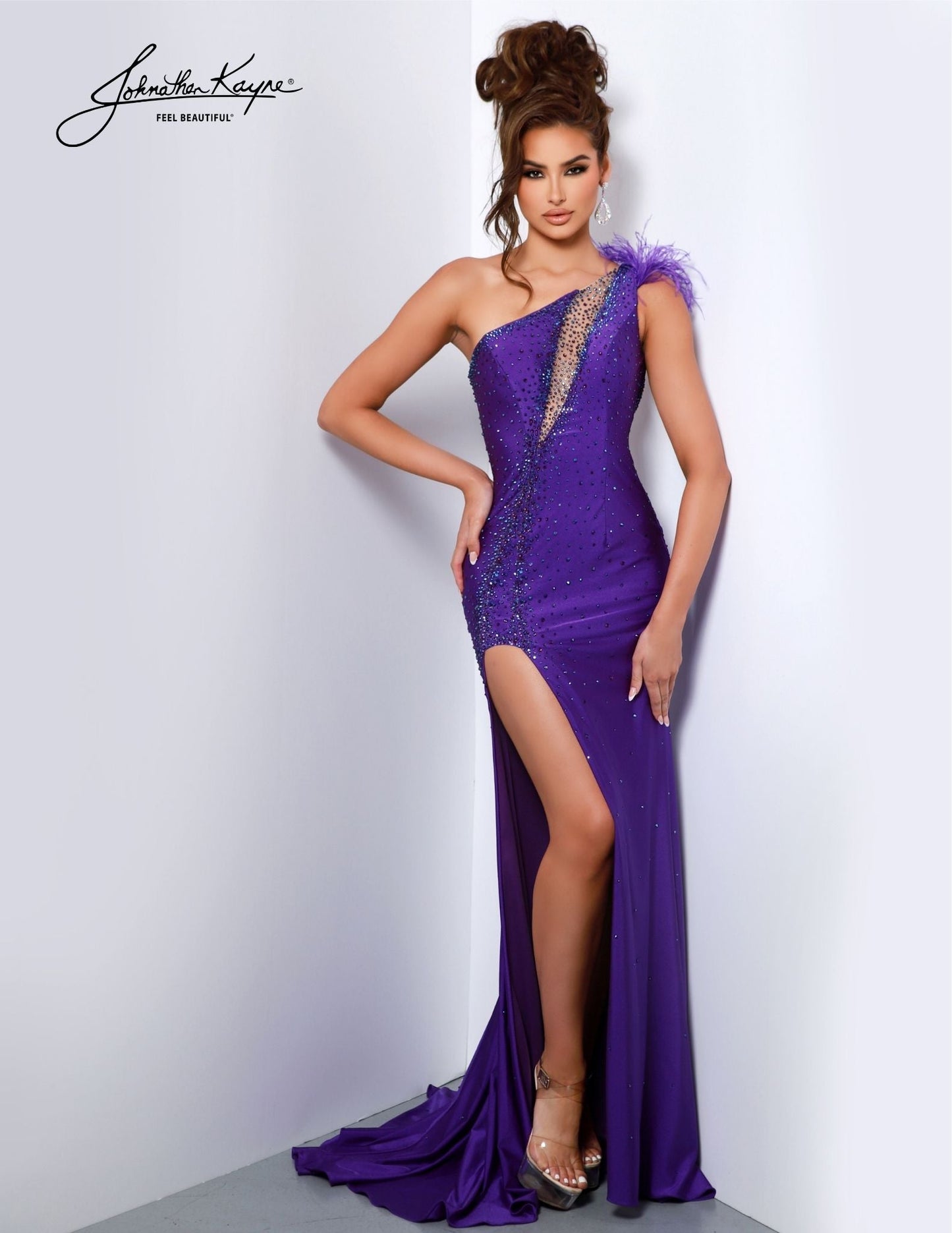 The Johnathan Kayne 2810 Long Prom Dress exudes elegance with its fitted one-shoulder style, intricate feathered accents, and dramatic maxi slit. Stylish and sophisticated, this formal gown is sure to make a lasting impression. Let your inner diva shine bright in this 4 Way Stretch Lycra gown. This dress will ensure that all eyes are on you as you make a grand entrance.