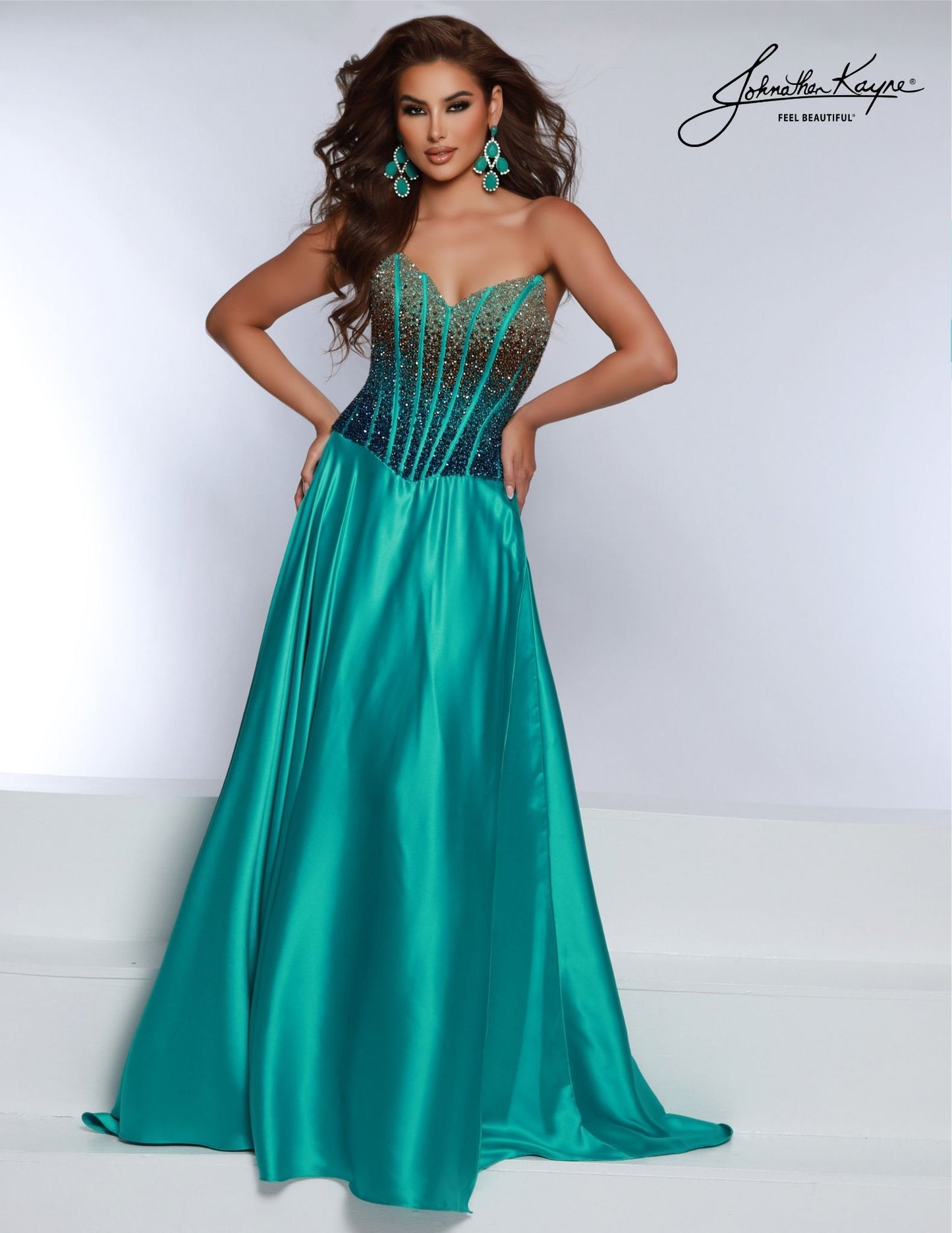 The Johnathan Kayne 2812 is a stunning A-line corset formal gown, crafted with an open back and beading to enhance your silhouette. Perfect for prom or special events, this gown will make you feel like the belle of the ball. Elevate your elegance with this breathtaking strapless ombre beaded bodice – the gradual shift in colors come together to create a show-stopping effect. The flowing A-line skirt makes this perfect for all body types. 