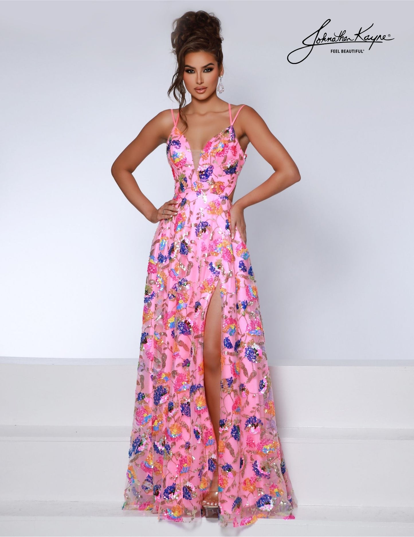 Johnathan Kayne 2813 is an elegant long prom dress featuring a plunging V-neckline, an open back with a slit, and sparkling sequin and beaded accents. Be the belle of the ball in this timeless and sophisticated formal gown.