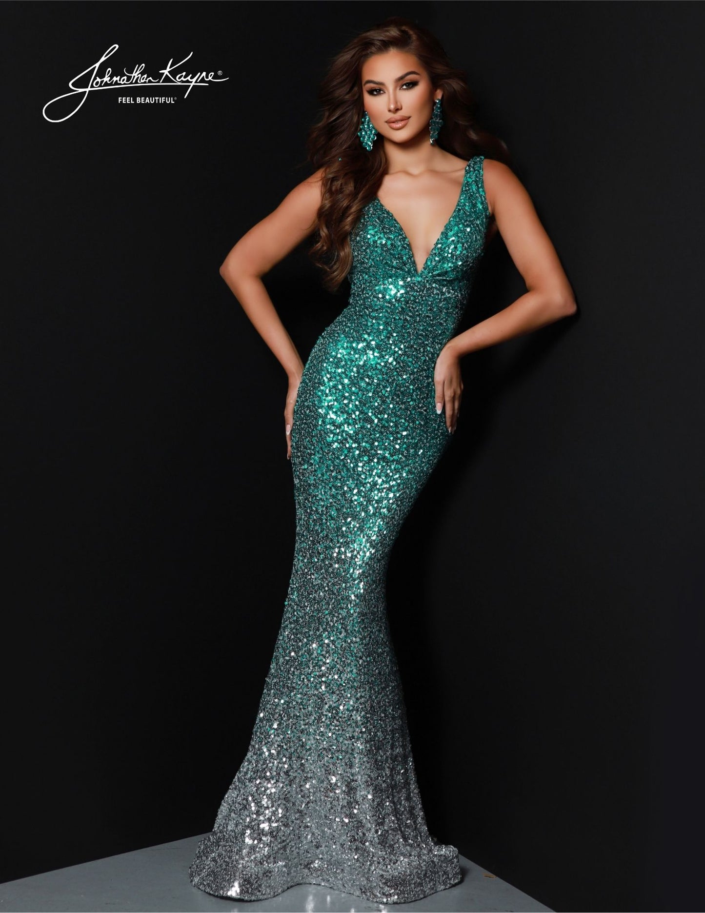 Look your best at any formal occasion in this Johnathan Kayne 2814 Long Prom Dress. With features such as a mermaid silhouette, v-neck, and sequin bodice, this dress is perfect for prom or any special event. An open back completes the look, allowing you to show off your style. Look stunning in this beautiful gown.