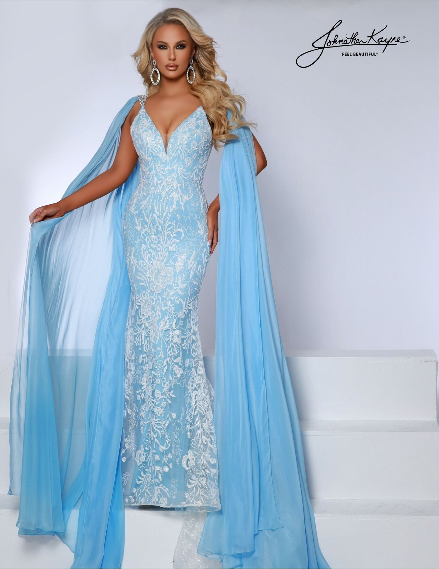 The Johnathan Kayne 2826 Long Prom Dress is a stunning choice for any special event. Its fitted sparkly mesh bodice and chiffon shoulder drapes give it a formal look, perfect for any pageant. It's sure to make you feel gorgeous for your special night. Drape yourself in elegance with our Sparkly Mesh Gown. The Fit and Flare Silhouette, complete with shimmering details and graceful chiffon shoulder drapes, is the perfect choice for a memorable prom night.