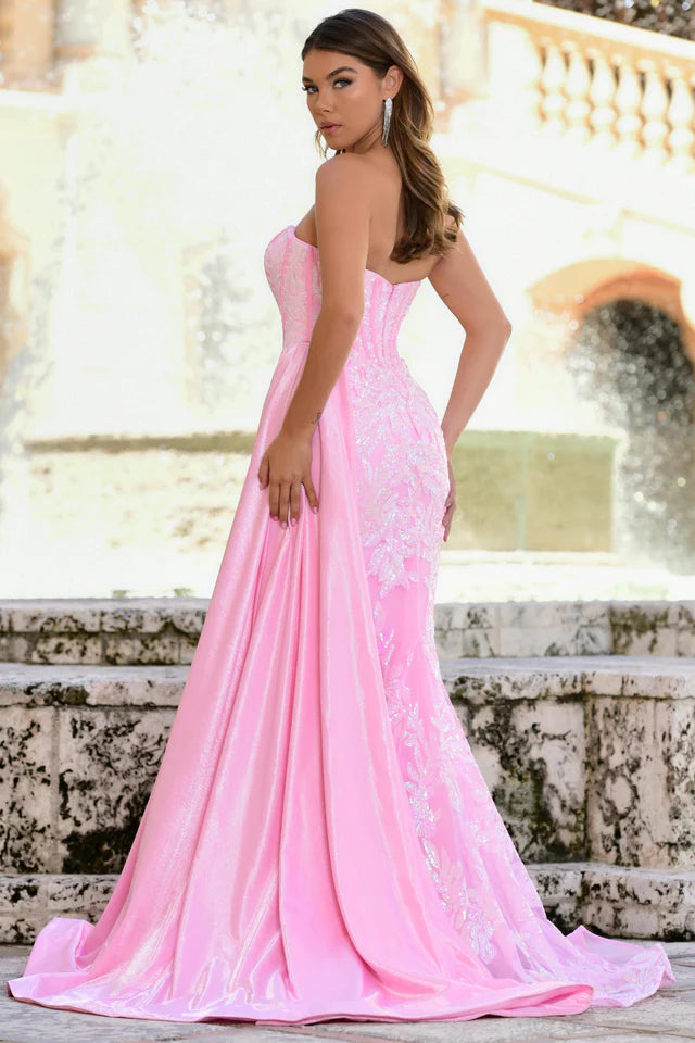Elevate your formal attire with the Ava Presley 28291 Long Prom Dress. This strapless gown features a flattering corset design, charming side drape, and elegant train. Made with luxurious charmeuse fabric, it exudes sophistication and grace. Perfect for pageants, proms, or any special occasion.