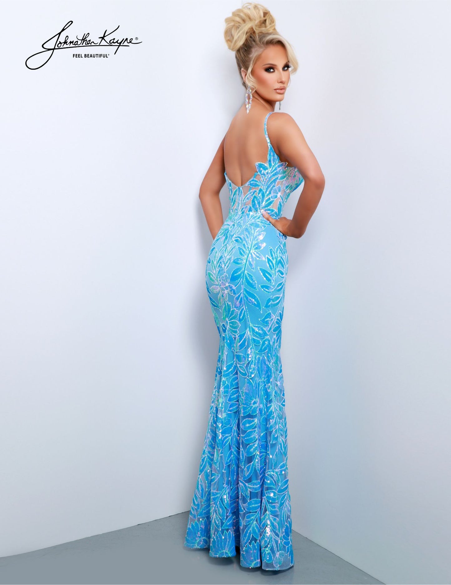 This glamorous Johnathan Kayne 2837 gown will make you sparkle on your special occasion. Featuring a mesh corset, sequined bodice and a sheer overlay with a high-slit, this glamorous formal gown is sure to turn heads. Perfect for pageant or prom events. Dress to mesmerize in our Sequin Mesh gown, a testament to bold flair. The exposed boning and sheer bodice add drama, while the thigh-high slit ensures you're the center of attention.
