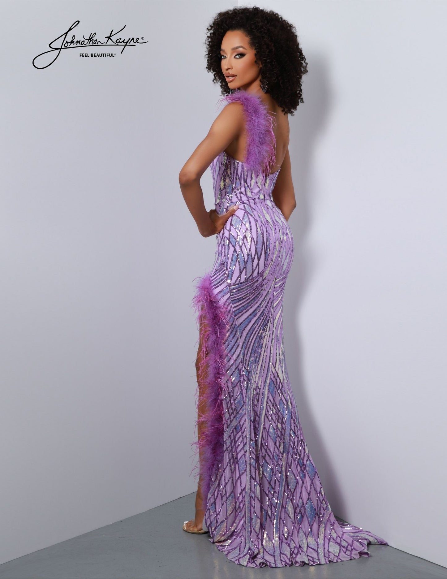 Look stunning in the Johnathan Kayne 2844 Long Prom Dress. This fitted one-shoulder gown features a delicate sequin powermesh, slit details feathers for a striking look. Perfect for an elegant night on the town or any formal occasion. Prepare to steal the show! This one-shoulder wonder is adorned with mesmerizing sequins that shimmer and sparkle, ensuring you radiate elegance and glamour. 