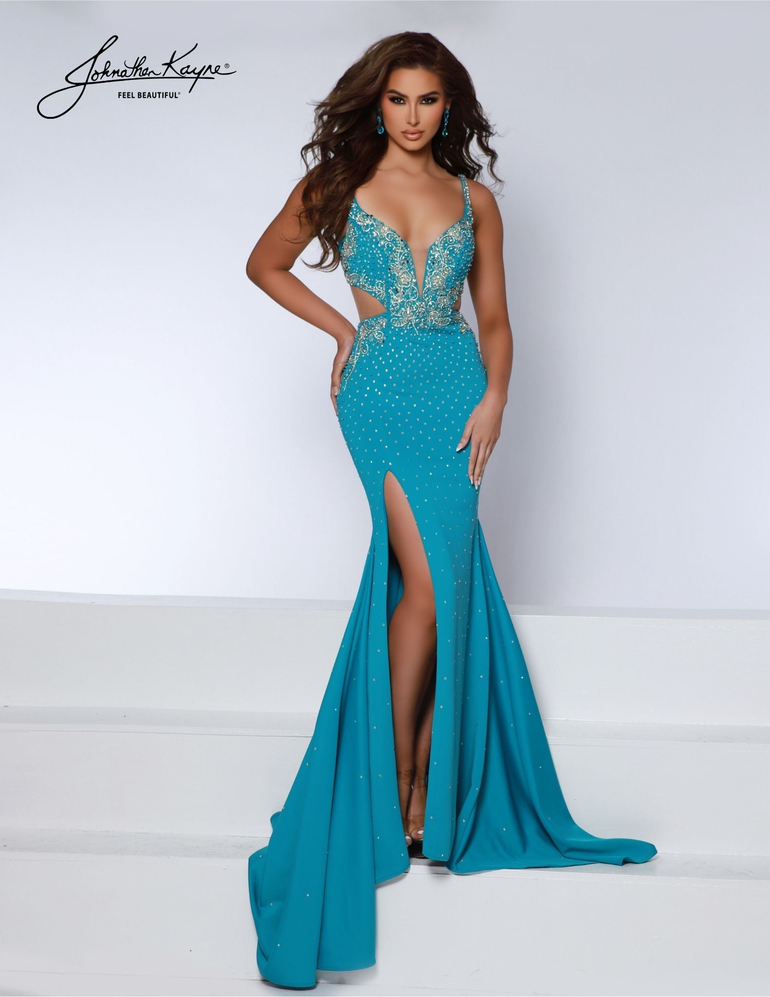 Johnathan Kayne 2846 is the perfect long prom dress for special occasions. Featuring a fitted plunging neckline and a classic high slit, this sophisticated formal pageant gown is complete with side cut outs. Look your best in this stunning evening look. Steal the spotlight in this heavy knit gown. Flirty side cutouts, thigh-high slit, and a corset closure transform this dress into a show-stopping statement of style.