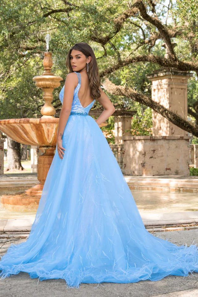 This stunning Ava Presley 28572 prom dress features a fitted sequin bodice with a beautiful organza skirt and delicate feather detailing. The V neckline adds a touch of elegance to this formal pageant gown. Make a statement at any event with this eye-catching dress.