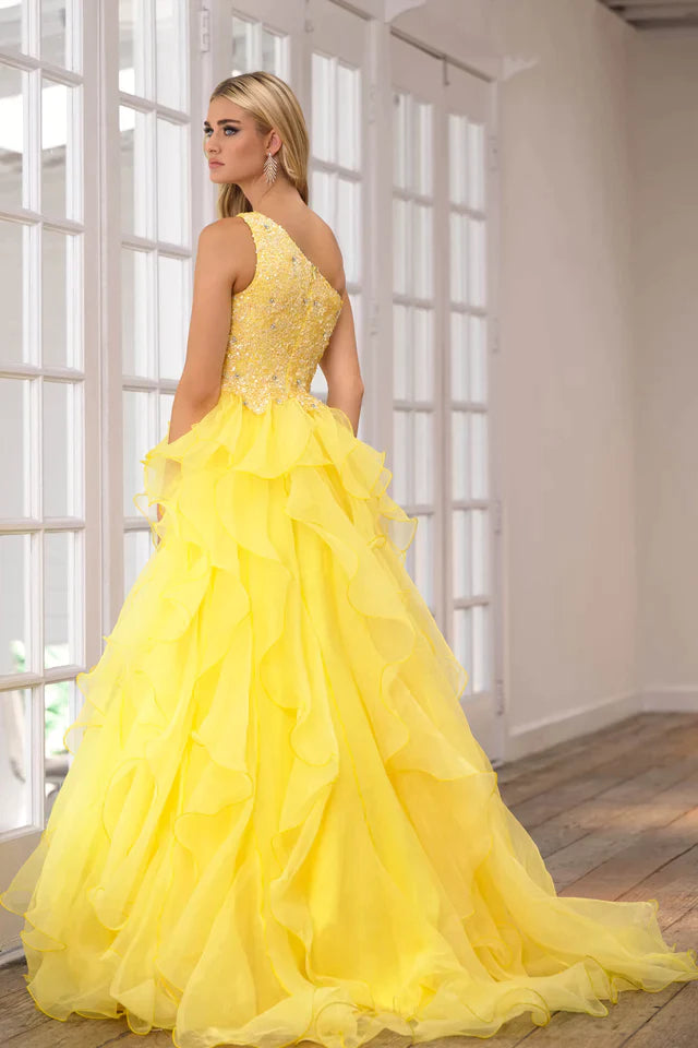 Be the belle of the ball in the Ava Presley 28576 Long Prom Dress. The chic one shoulder design and sparkling sequin bodice will turn heads, while the layered organza skirt adds dramatic flair. Perfect for formal events and pageants.