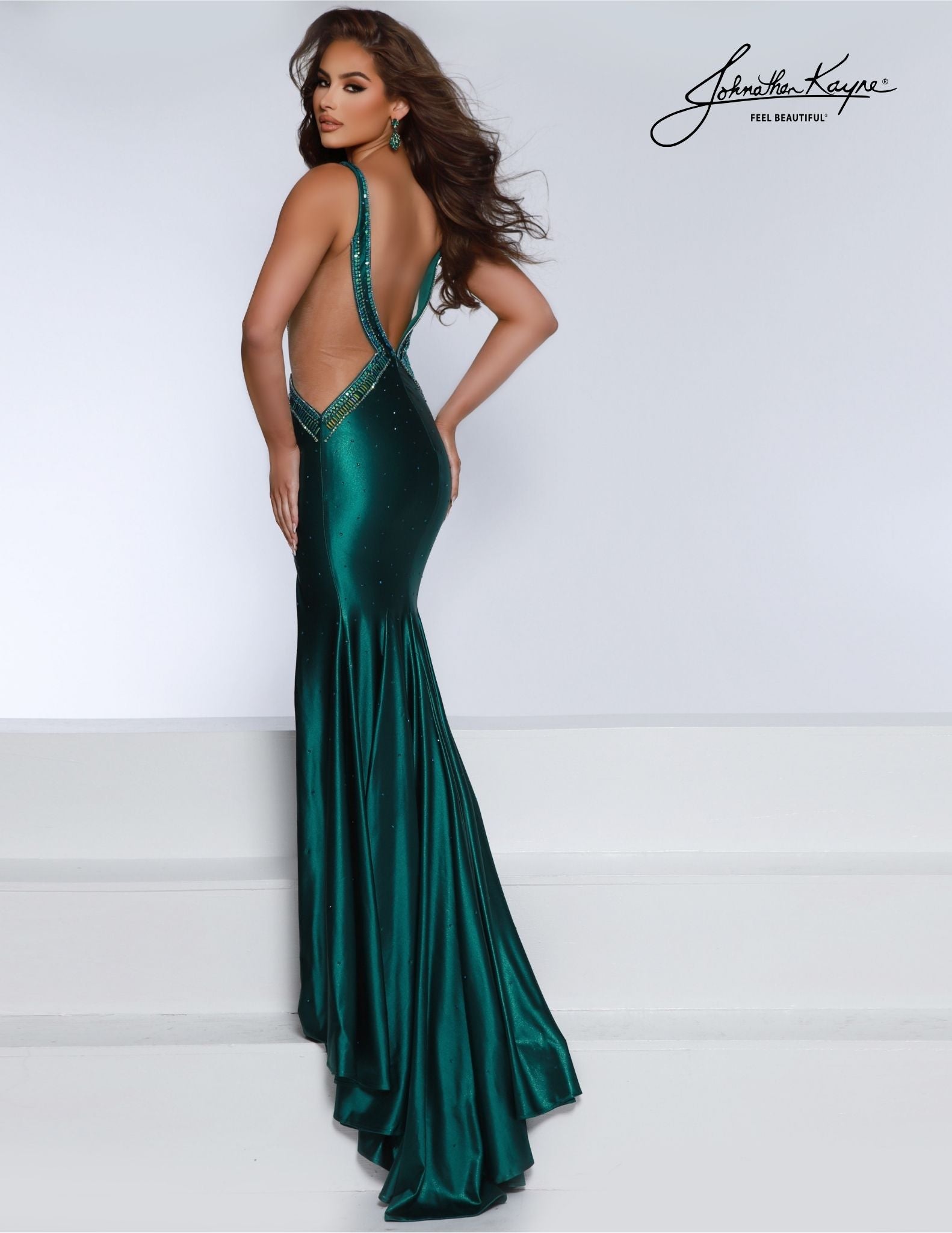 Look stunning for your next special event in this Johnathan Kayne 2857 Long Prom Dress. It features a plunging neckline, encrusted beading along the  sheer side cutout, and an intricate beaded pattern throughout. Perfect for any formal occasion, this glamorous gown will make you shine. Prepare to turn every head in the room in this Shiny 4 Way Stretch Lycra gown. 