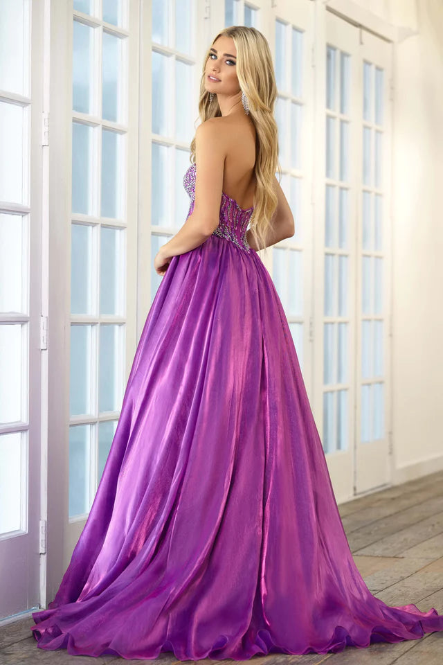 Expertly crafted by Ava Presley, the 28588 Long Prom Dress boasts a strapless, open back design that accentuates the A-line ballgown silhouette. The crystal bodice adds a touch of glamour, making it the perfect choice for a formal event or pageant. Show off your elegant style with this stunning dress.