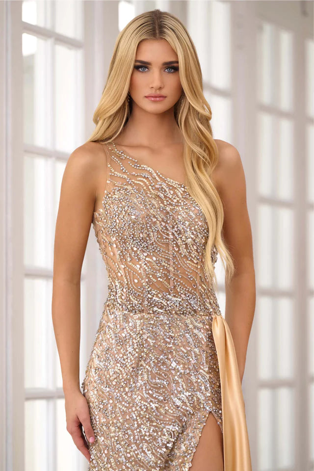 Expertly crafted for the ultimate prom or pageant look, the Ava Presley 28589 Long Prom Dress features a stunning one shoulder design, intricate beaded crystal detailing, and a sheer bodice for a touch of elegance. With a sleek side satin skirt and a high slit, this formal gown exudes sophistication and style.