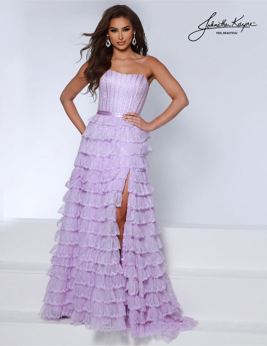 This Johnathan Kayne 2861 Long Prom Dress elegantly combines luxurious details like corset lace and ruffles with a strapless A-line silhouette. Perfectly crafted for formal occasions and pageants, it's the ideal gown for a sophisticated evening. Prepare to captivate in our strapless lace A-line gown. The cascading ruffles create an air of enchantment, while the exposed boning adds a touch of charm. The daring slit and corset back completes the look.