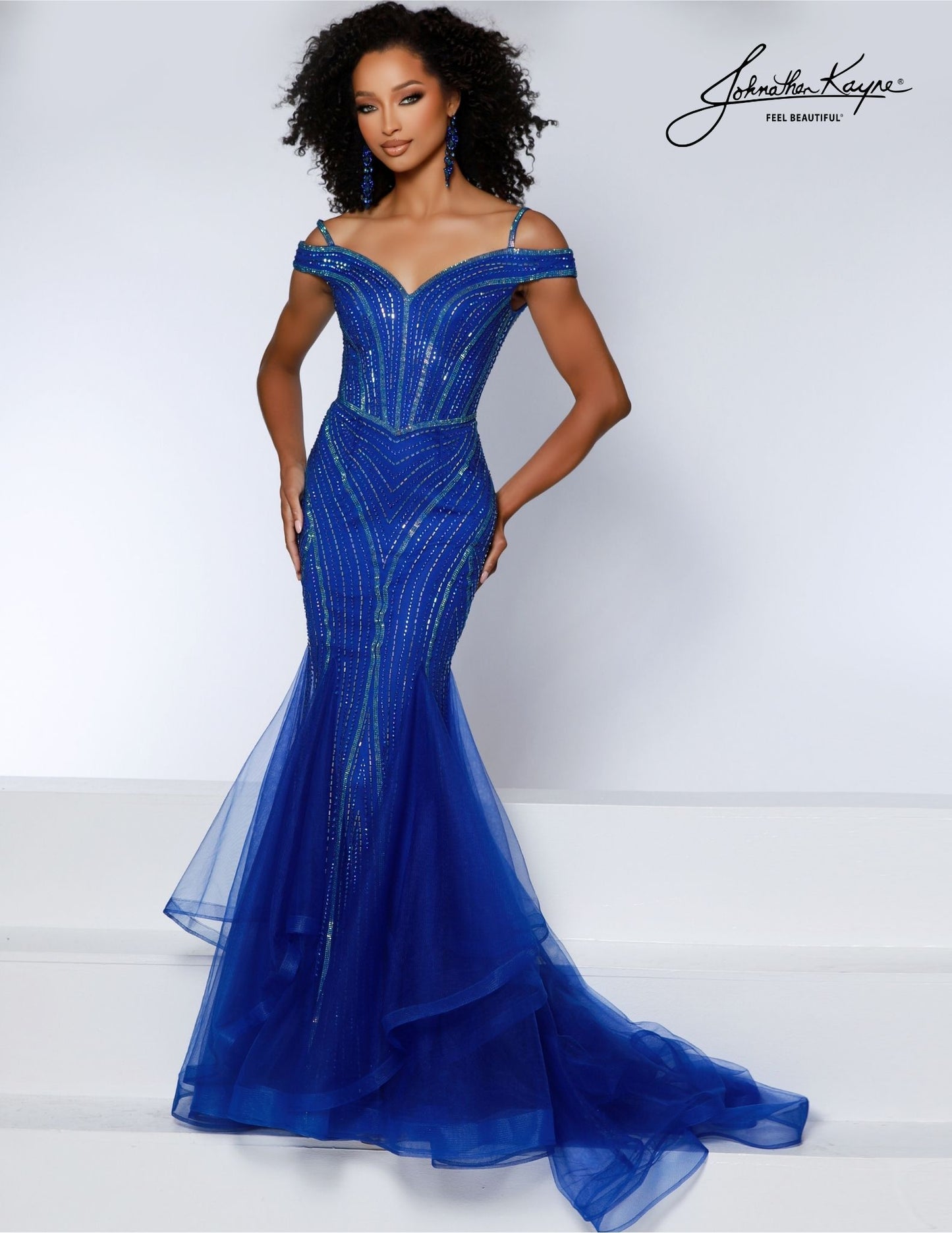 Johnathan Kayne 2866 offers an elegant off-shoulder fitted mermaid silhouette gown. It has intricate beadwork, mesh accents, and a full-length train. Crafted for special occasions, this timelessly beautiful dress will make you shine on your special night. Turn heads, ignite envy! This off-the-shoulder mermaid gown is your ticket to being the star of the show.