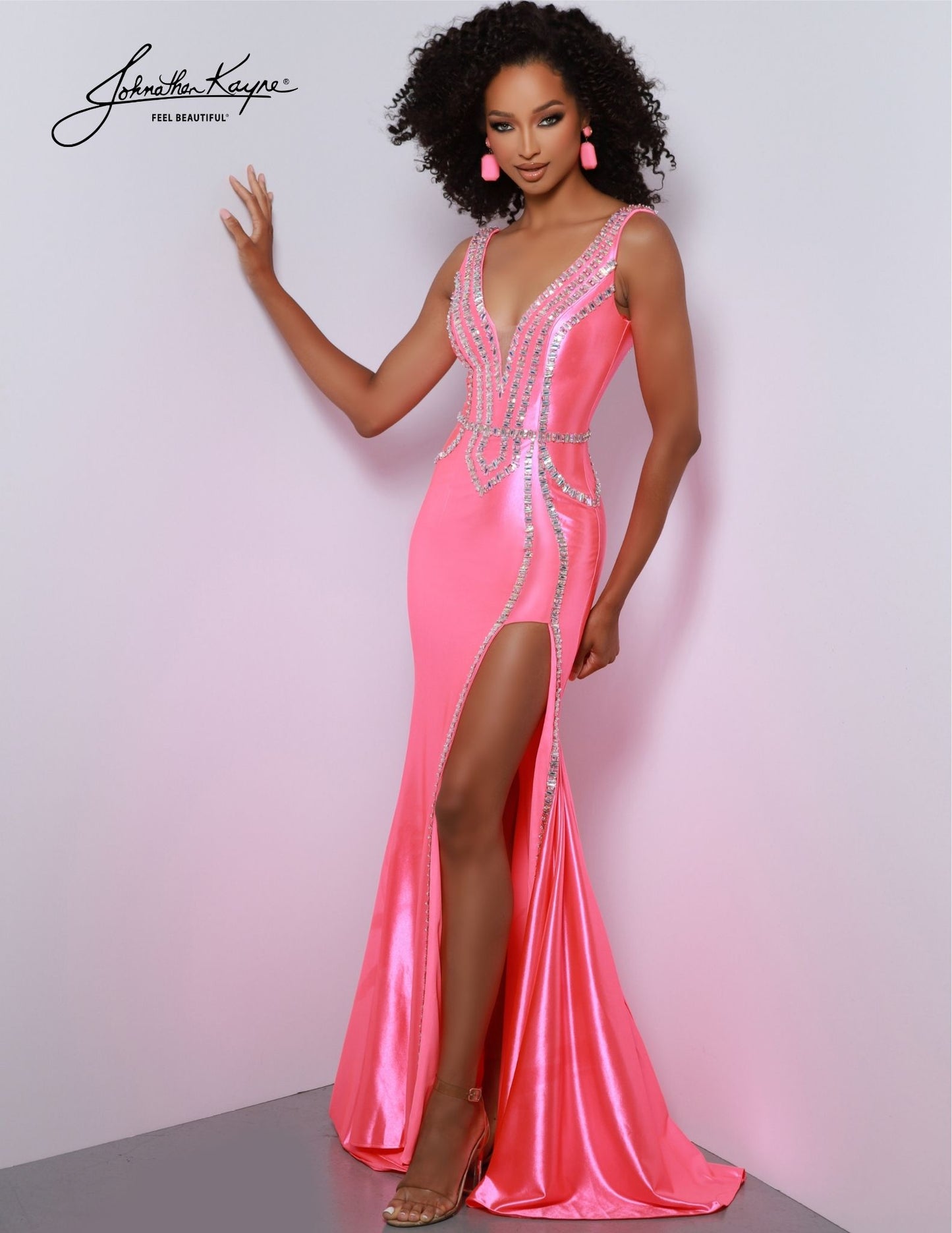 Look stunning at your next special event in the Johnathan Kayne 2867 dress. This gorgeous prom dress features a sheer deep V-neckline, beaded embellishments, and high side slit to show off your legs. The perfect formal gown for prom, pageants, or any special occasion. Raise eyebrows, drop jaws. Elevate your style and command attention in this Shiny 4 Way Stretch Lycra gown. The daring slit will ensure all eyes are on you.