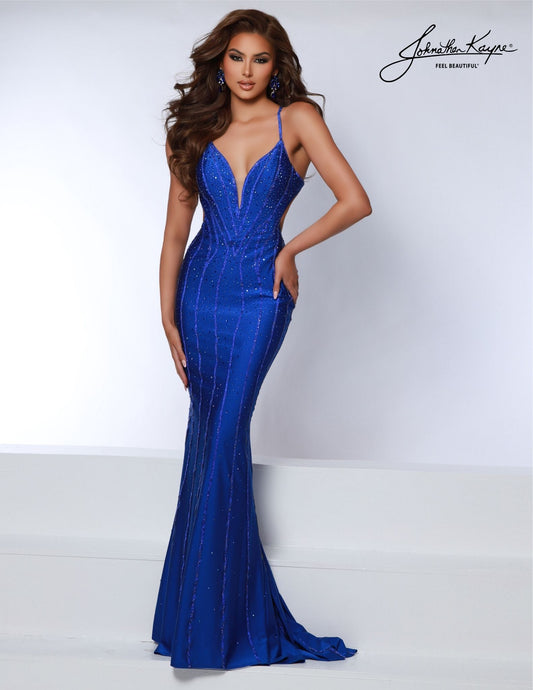 The Johnathan Kayne 2868 mermaid gown features a fitted plunging v-neckline and crystal accents for a stunning look. Perfect for formal occasions such as proms, pageants, or special events, the dress is sure to make an impact. The back takes center stage in this 4 Way Stretch Lycra gown. This gown features rows of crystal trim and a low back that is sure to steal the show and making sure you leave a lasting impression from every angle.