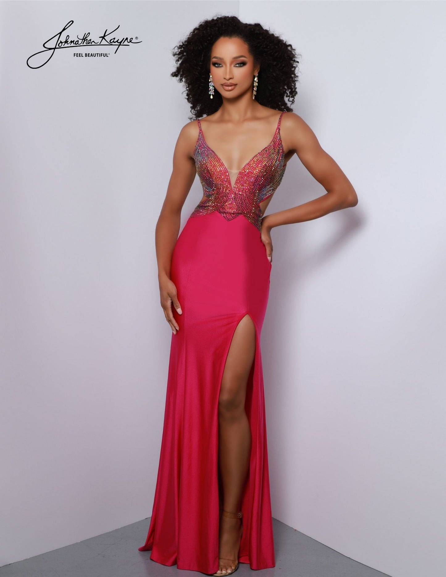 The Johnathan Kayne 2869 formal dress is a stunning choice for prom, pageant, and other special occasions. Featuring an ombre stoned design and plunging V neckline, this gown is sure to make an impression. It also has a cut-out train and sides for a unique and sophisticated look. The perfect prom dress is here! Featuring an ombre stoned bodice with side cut outs and a low back, you are sure to be the best dressed in this.